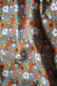 Asymmetric flower power top